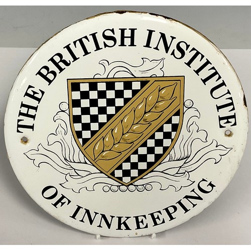 481 - An enamel sign wall plaque, The British Institute of Innkeeping, 23cm diameter