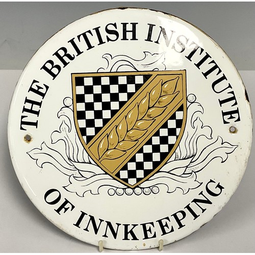 481 - An enamel sign wall plaque, The British Institute of Innkeeping, 23cm diameter