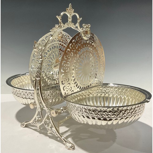 483 - A silver plated Victorian style biscuit box, of circular form, hinged pierced lids to both sections,... 