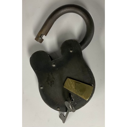 495 - A large iron padlock, brass escutcheon, 23.5vm high, two keys