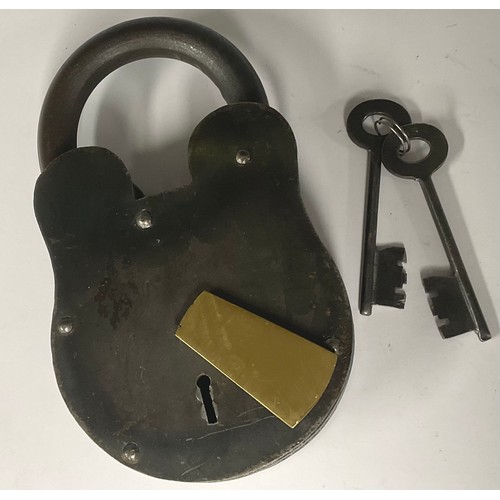 495 - A large iron padlock, brass escutcheon, 23.5vm high, two keys