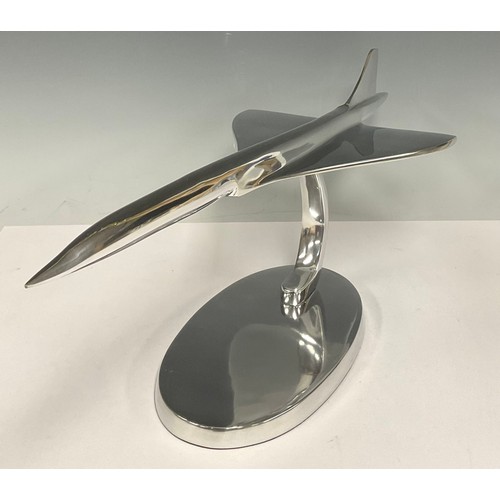 497 - A large chrome desk model of Concorde, on stand, 61cm long, 19.5cm high