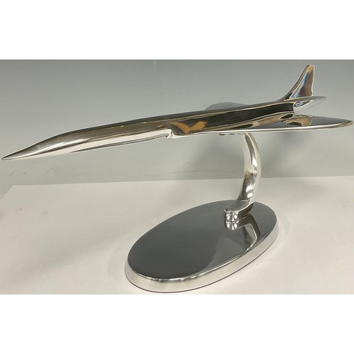 497 - A large chrome desk model of Concorde, on stand, 61cm long, 19.5cm high