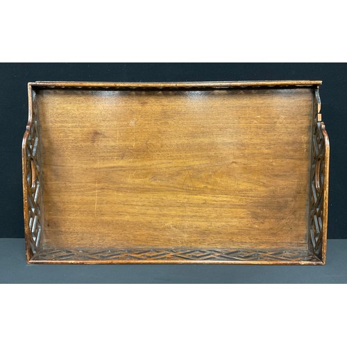 511 - A George III style serving tray, the fretwork gallery in the cockpen manner, 76.5cm wide