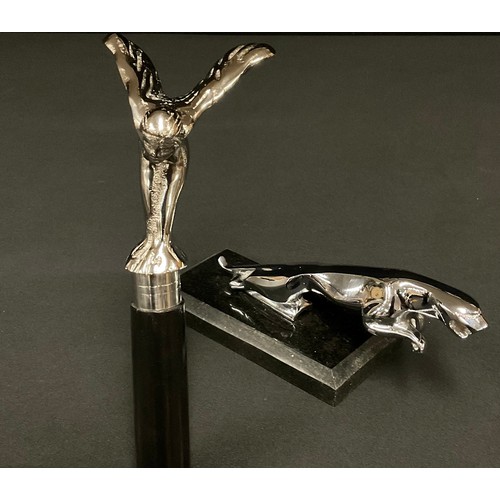 514 - An ebonised walking stick, the handle as a Rolls Royce Spirit of Ecstasy car mascot, 97.5cm long; a ... 