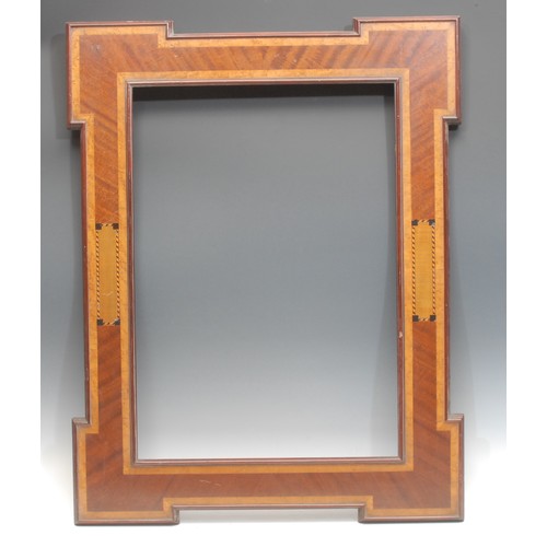 2011 - An Edwardian mahogany and inlaid shouldered rectangular frame, the aperture 60cm x 43cm