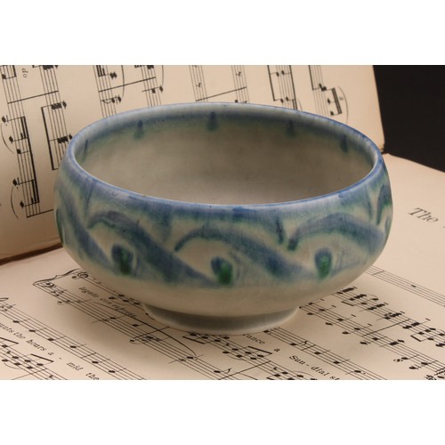 2410 - A Pilkington's Royal Lancastrian bowl, decorated in tones of mottled blue and green with stylised Vi... 