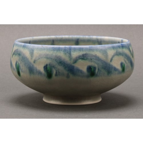 2410 - A Pilkington's Royal Lancastrian bowl, decorated in tones of mottled blue and green with stylised Vi... 