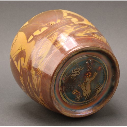 2391 - A Pilkington's Royal Lancastrian ovoid vase, decorated in copper lustre with galleons on a yellow gr... 