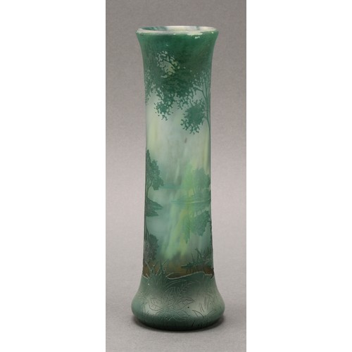 2464 - A Daum Nancy cameo glass vase, decorated in tones of green with a woodland landscape, 20cm high, sig... 