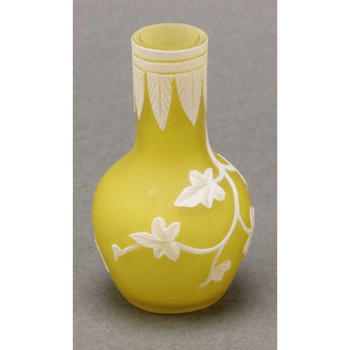 2467 - A miniature cameo glass vase, in the manner of Thomas Webb, decorated with trailing ivy on a yellow ... 