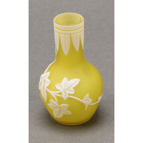 2467 - A miniature cameo glass vase, in the manner of Thomas Webb, decorated with trailing ivy on a yellow ... 