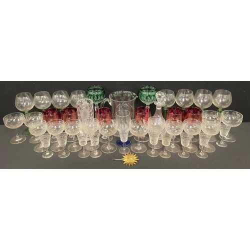 2419 - Glassware - a set of six cranberry glass wine glasses, 13.5cm high; a set of eight continental wine ... 