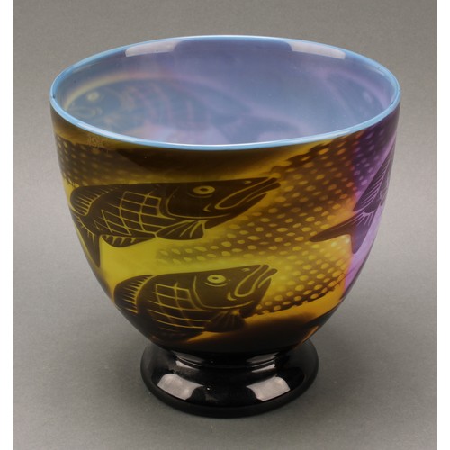 2416 - A studio glass graal vase, by John Ford, decorated with fish intones of purple and green, signed to ... 