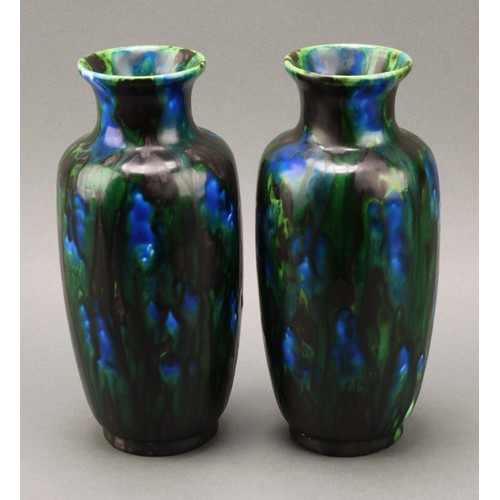 2433 - A pair of Minton, Hollins & Co. ovoid vases, Astra Ware vases, drip glazed in peacock feather tones,... 