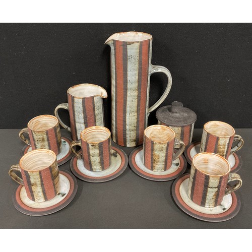 2422 - A Briglin Pottery studio coffee service, banded in tones of brown, and grey, the pitcher 26cm high