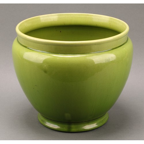 2428 - A Holdcroft art pottery ovoid jardinière, glazed in tones of mottled green, 23cm high