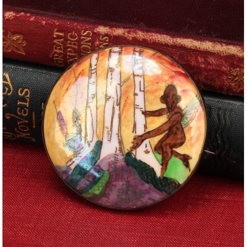 2450 - A Wedgwood Fairyland lustre circular brooch, decorated in the Woodland Elves III pattern, designed b... 