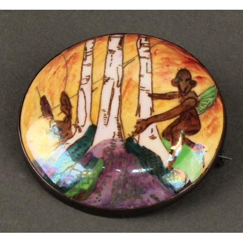 2450 - A Wedgwood Fairyland lustre circular brooch, decorated in the Woodland Elves III pattern, designed b... 