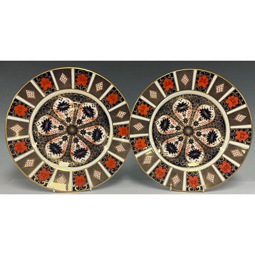 5055 - A pair of Royal Crown Derby 1128 Imari pattern dinner plates, 27cm diameter, first quality