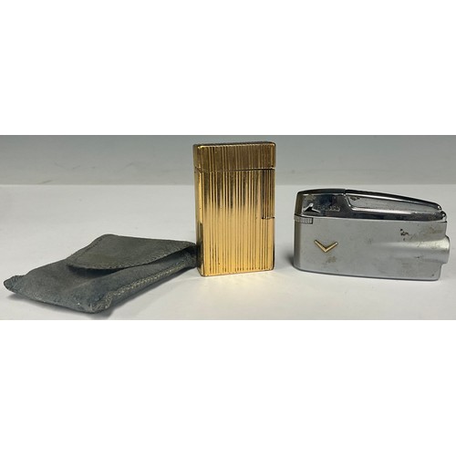 5063 - An S.T. Dupont rectangular cigarette lighter, fluted sides, mark and serial number to base, 6cm x 3.... 