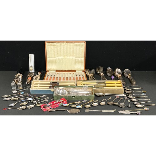 5077 - A collection of silver and silver plated souvenir spoons; a set of Mappin & Webb flatware for eight;... 