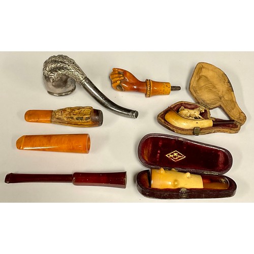 5111 - A bear claw pipe; cheroot and cigar holders; etc