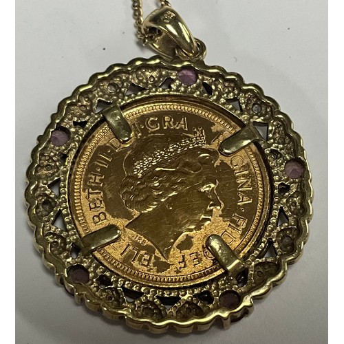 5150 - A half soverign, 2005, in mount set with diamond chips and pink stones, 9ct gold chain, 10.9g gross