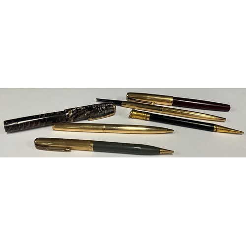 5157 - A Parker fountain pen, push close rolled gold cap, burgundy; a Parker rolled gold mechanical pencil;... 