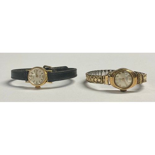 5159 - A lady's 14ct gold Mudu watch, baton indicators, the case marked 585, leather strap; a lady's 9ct go... 