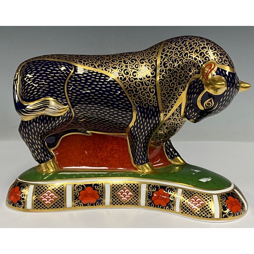 5001 - A Royal Crown Derby paperweight, Grecian Bull, painted in the Imari palette, 19cm long, gold stopper... 