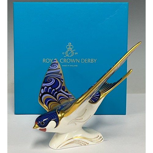 5006 - A Royal Crown Derby paperweight, Swallow, 17cm wide, gold stopper, printed marks in grey, boxed