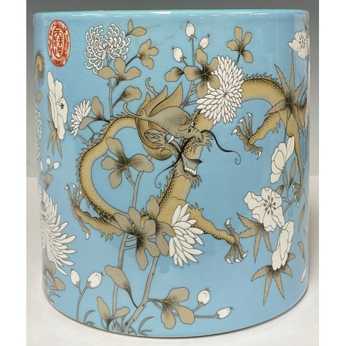 5485 - A large Chinese porcelain pale blue and celadon brush pot, decorated with dragons and foliate motifs... 