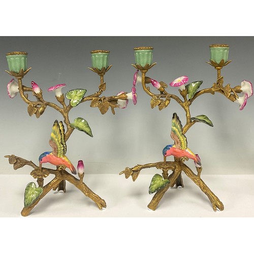 5486 - A pair of gilt bronze two light candelabra, decorated with humming birds and flowers, 25.5cm high