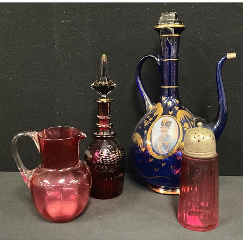 5489 - Turkish wine jug, two portrait panels; cranberry jug; sifter; a bohemian red glass decanter (4)