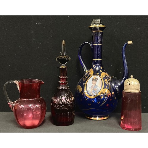 5489 - Turkish wine jug, two portrait panels; cranberry jug; sifter; a bohemian red glass decanter (4)