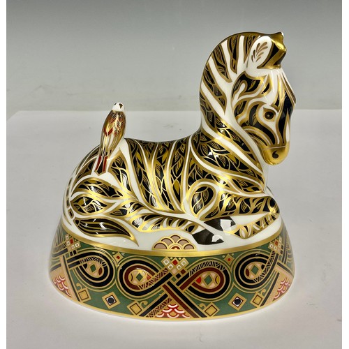 5015A - A Royal Crown Derby paperweight, recumbent Zebra, 13cm high, printed marks in red, gold stopper