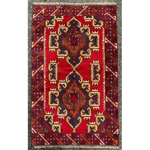 5522 - Oriental Rugs and Carpets - a Baluchi carpet, 138cm x 85cm