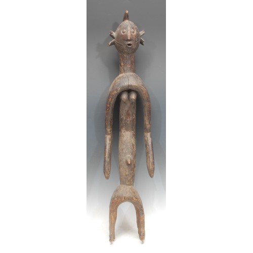 64 - Tribal Art - a Mumuye figure, of typical elongated form, ovoid head with stylised abstract features,... 