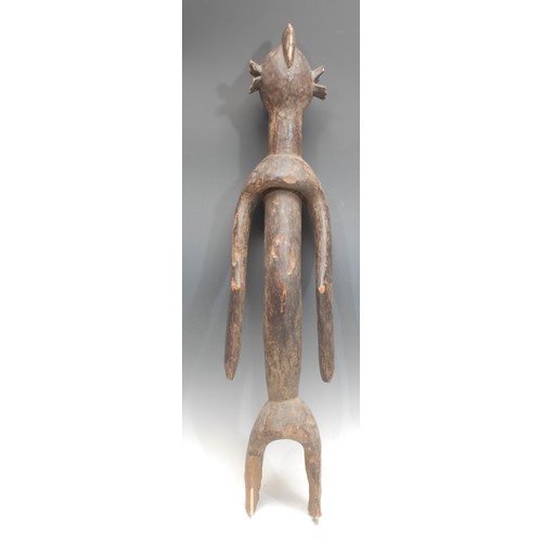 64 - Tribal Art - a Mumuye figure, of typical elongated form, ovoid head with stylised abstract features,... 