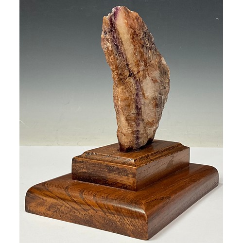 175 - A Derbyshire Blue John specimen section, part polished, 13cm, mounted on an oak plinth base