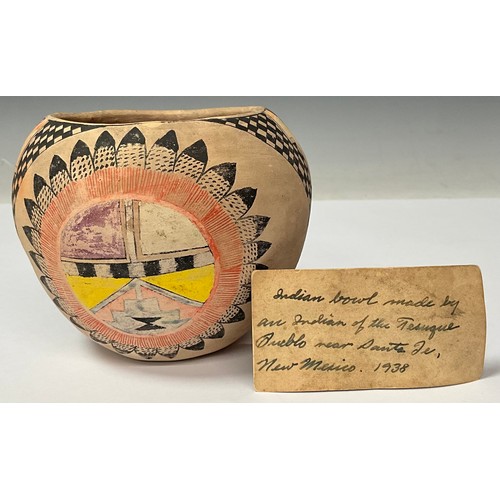 83 - Tribal Art - a Tesuque Pueblo Native American pottery ovoid vessel, decorated in polychrome with geo... 