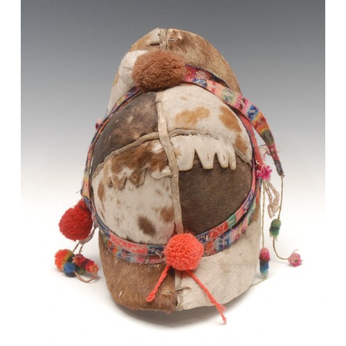 15 - Tribal Art - a Bolivian Montera, ceremonial cowhide helmet of a Tinku dancer, 29cm high