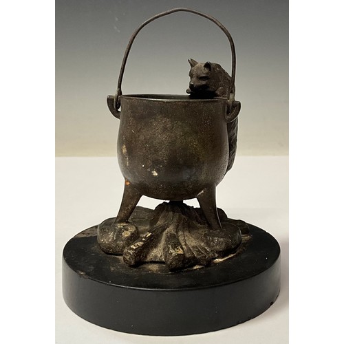 965 - A 19th century Continental bronze, of a cat peering into a cauldron, circular black slate base, 10cm... 