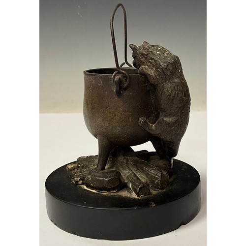 965 - A 19th century Continental bronze, of a cat peering into a cauldron, circular black slate base, 10cm... 