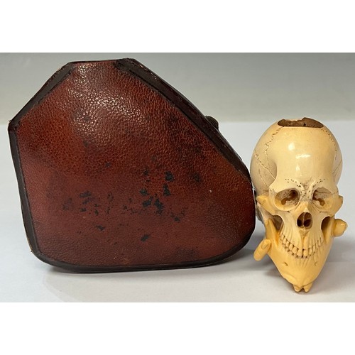 959 - The Macabre - A Victorian memento mori Meerschaum pipe, as a hand holding a skull, Morocco leather c... 