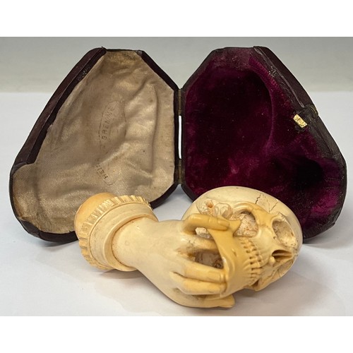 959 - The Macabre - A Victorian memento mori Meerschaum pipe, as a hand holding a skull, Morocco leather c... 