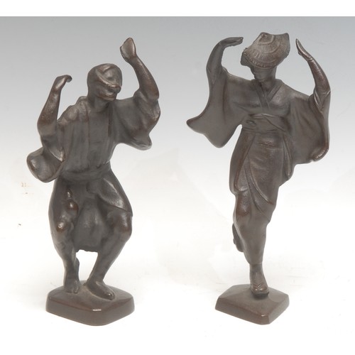 930 - A pair of Japanese Takahashi Keiten style dark patinated cast iron stylised Awa dancing figures, 18.... 