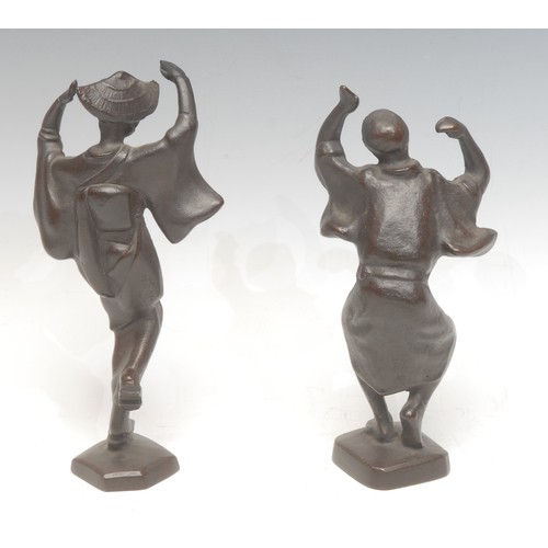 930 - A pair of Japanese Takahashi Keiten style dark patinated cast iron stylised Awa dancing figures, 18.... 