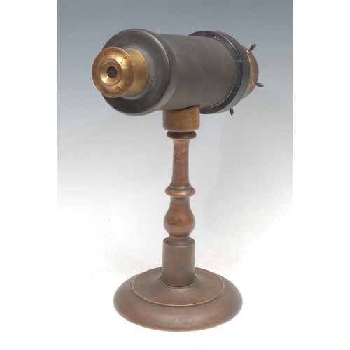 919 - Victorian Pastimes - a 19th century brass kaleidoscope, ship's wheel turning handles, mounted for di... 